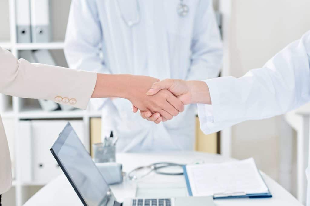 Doctor and patient shaking hands