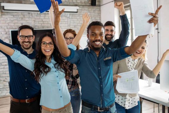 Happy successful company staff in office Happy successful company staff in office